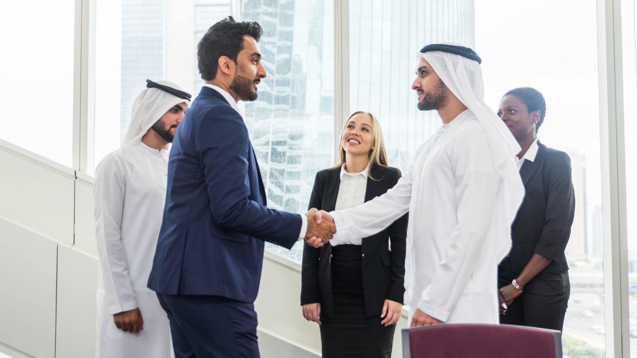 Dubai sheikh joining hands with a businessman